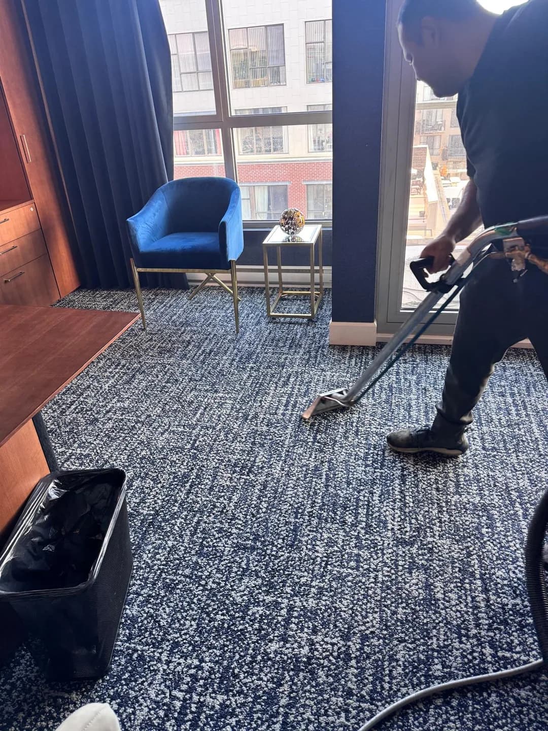 A Push Push team member extraction-cleans a carpet at a CAPREIT property.