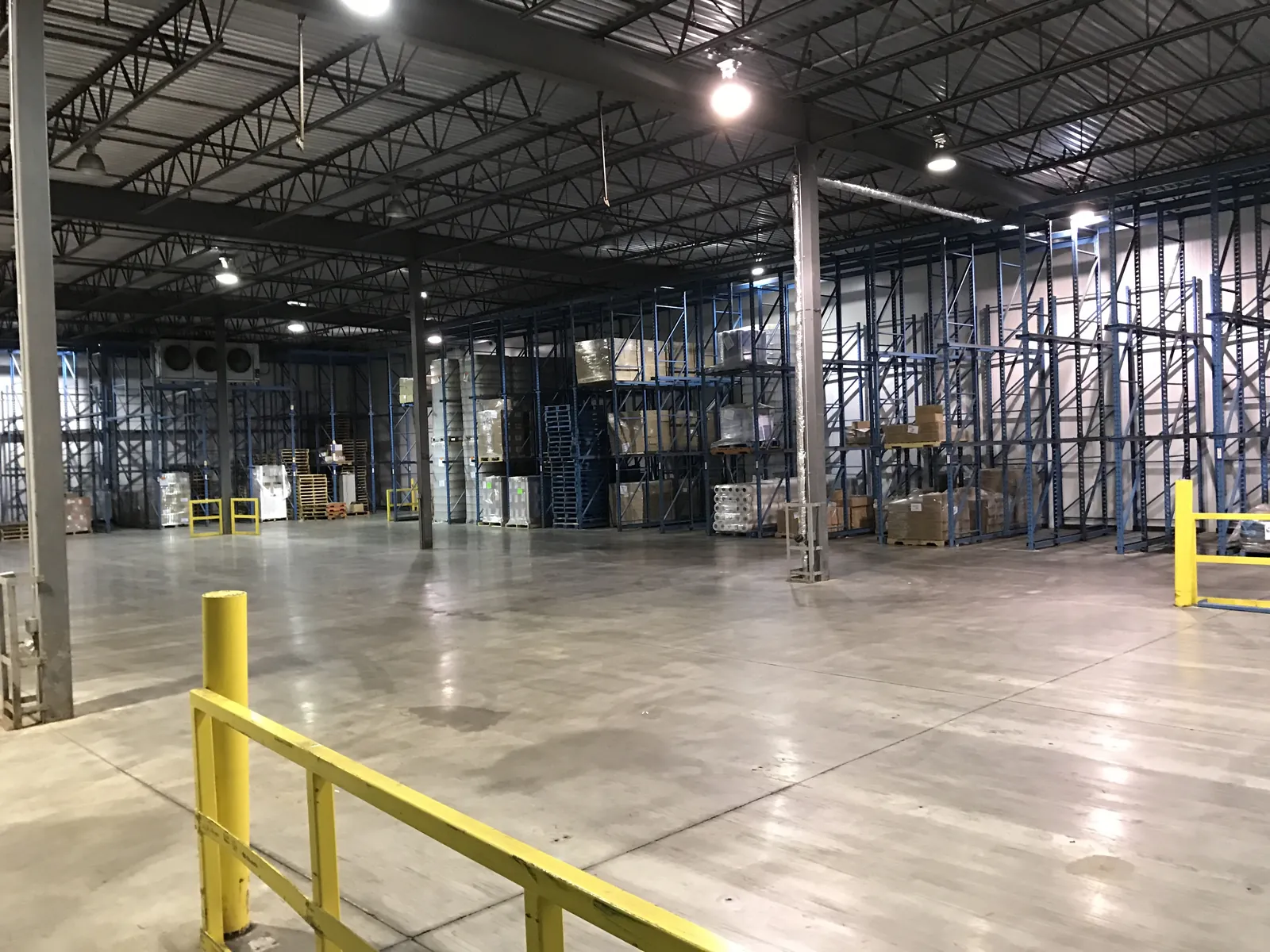 Warehouse racking and a polished concrete floor.
